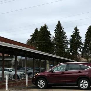 a car parked in front of the restaurant
