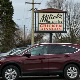 a car parked in front of a restaurant