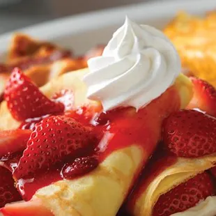 Strawberry Crepes Brunch - Two strawberries and cream Crêpes, served with hashbrowns and cherrywood-smoked bacon strips or sausage links