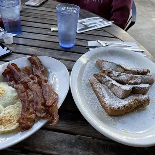 two plates of breakfast food