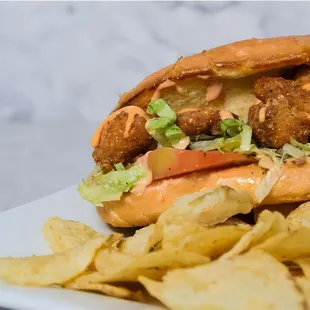 a sandwich and chips on a plate