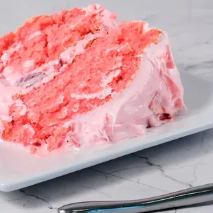 a slice of strawberry cake on a plate