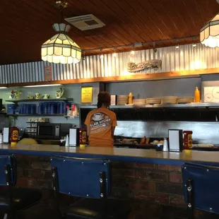a woman standing at the counter