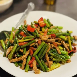 a plate of stir fried vegetables