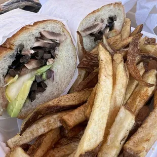 Vegan sandwich with fries.