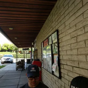 a man standing outside of a store