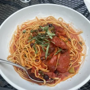 a plate of spaghetti and meat