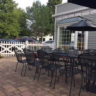 Great outdoor patio for dinner! Hidden from the street by bushes and a cute white fence