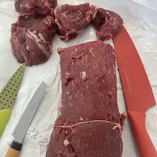 a piece of beef on a cutting board