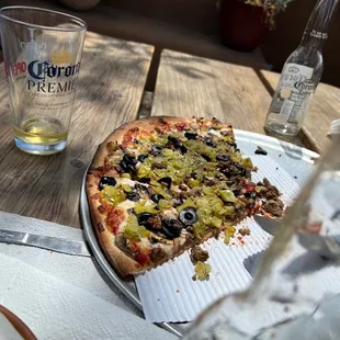 a slice taken out of the pizza