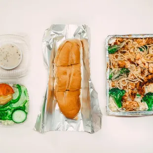 Homemade Chicken Broccoli Alfredo always served with garlic bread and side salad.