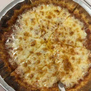 a cheese pizza on a pan