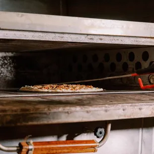 STONE OVEN COOKED PIZZA