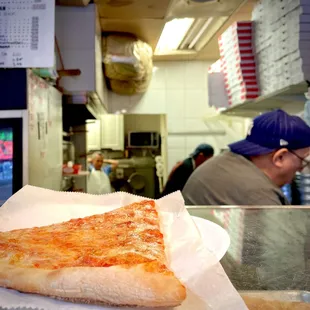 Cheese Pizza Slice fresh right out the oven. $3.27 + tip
