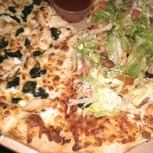 Half alfredo chicken with added spinach, taco pizza on right...both just okay