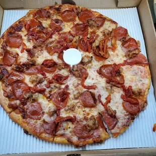 $25 for a medium cheese plus pepperoni, sausage and sundried tomato.  Very greasy