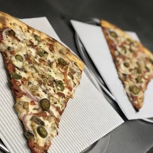 14inch Pizza by the slice $3.99 + .50 cents per topping