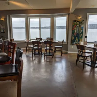 a dining room with a view of the water