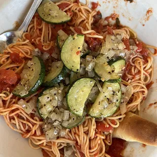 a plate of spaghetti and vegetables