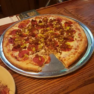 Medium pizza with pepperoni, sausage, bacon, and banana pepper.