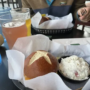 Pretzel bun sandwich and potato salad