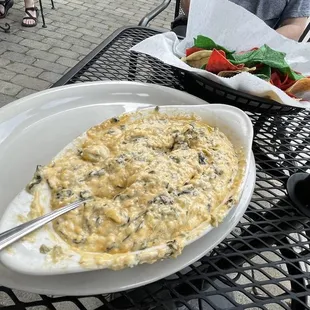 Artichoke dip, heavy on the cheddar.