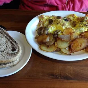 Italian sausage , cheese, and mushroom omelette with a side of rye toast just another awesome dish.