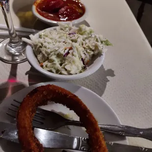 Onion ring garnish and sides (Cole Slaw and the Vegetable of the day - a tomato and zucchini stew)