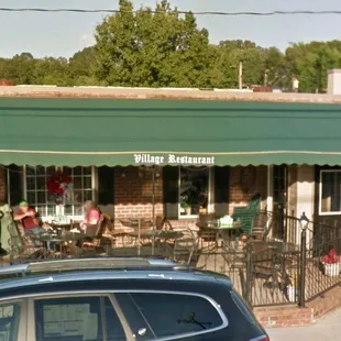 a car parked in front of the restaurant