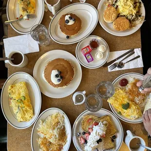 a table full of breakfast foods