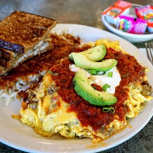 Migas: eggs scrambled with seasoned taco beef, Tillamook cheddar, red and green peppers, onions, and crispy tortilla strips ($18.50).