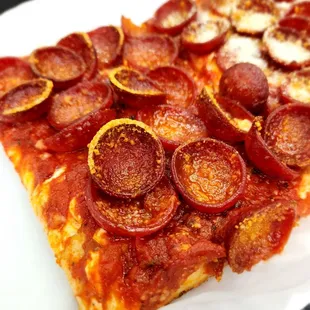 a slice of pepperoni pizza