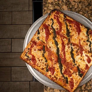 a slice of pizza on a serving tray