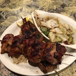 Sticky shrimp and fried bacon cabbage.