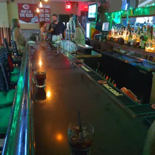a view of a bar with a drink on the bar