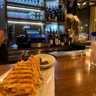 a plate of food on a bar counter
