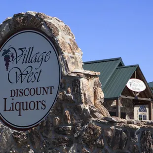 sign for village west discount liquors