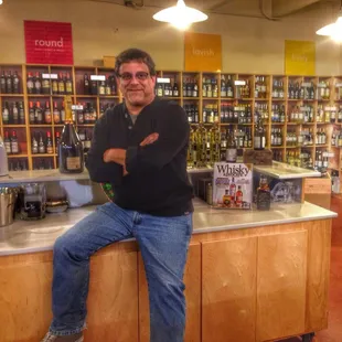 a man sitting on a counter