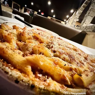 a close up of a pizza on a plate