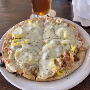 My pie size with sausage, banana peppers, and green olives.