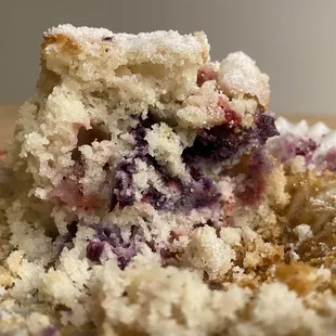 a blueberry muffin with a bite taken out of it