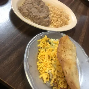 Single taco with rice and refried beans