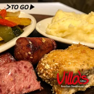 Sausages, Parmesan Pork, mashed potatoes,and vegetables.