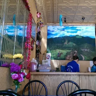 a woman sitting at the counter