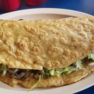 Tlayuda it&apos;s huge and super good. Delicia