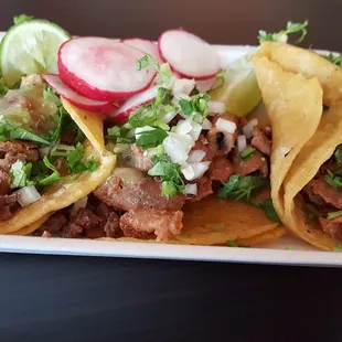 Carnitas and tripa tacos
