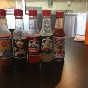 Lots of table hot sauce.