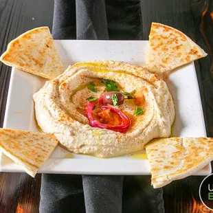 a plate of hummus and pita