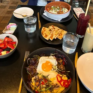 Shakshuka, Polenta dish, side of fruit, 2 smoothies (mixed berry and tropical)
