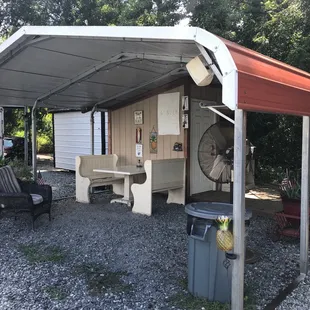 a patio with a table and chairs